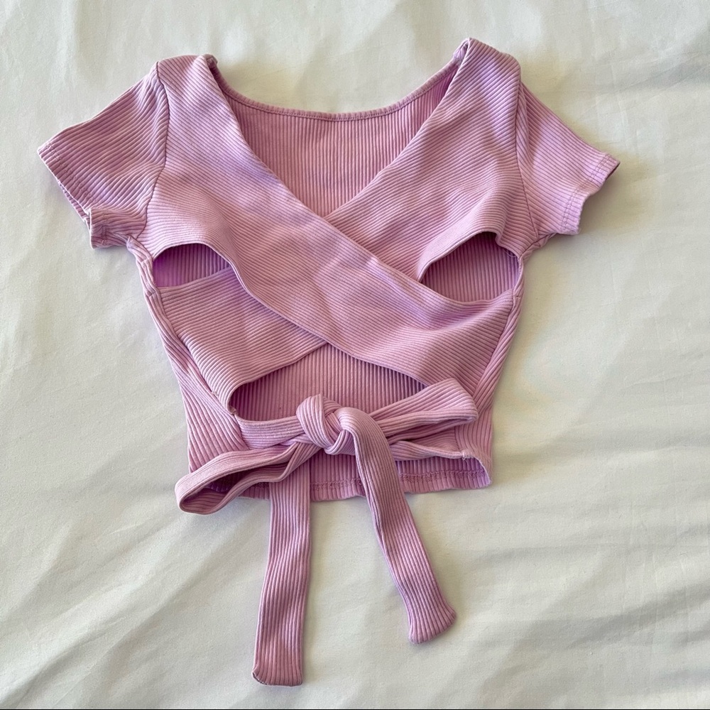 Cute light pink crop top with a criss cross tie on the back